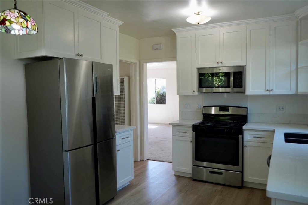 2117 Verde Street Pasadena, CA 91107 - Photo 5 of 13 a kitchen with stainless steel appliances a refrigerator microwave and stove