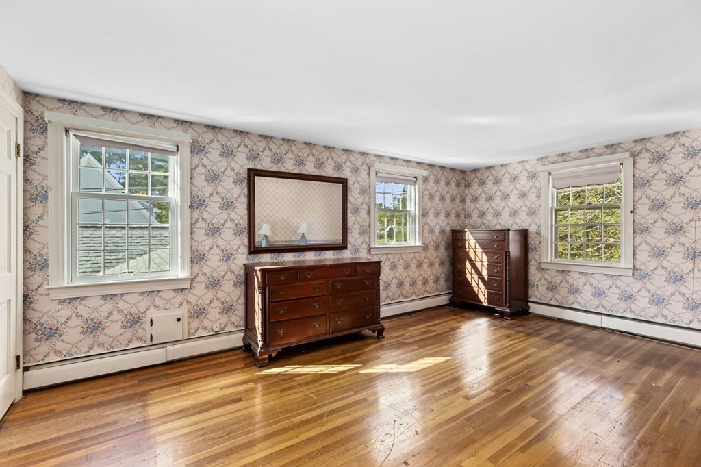 7 Zora Road Marion, MA 02738 - Photo 12 of 38 a view of an empty room with a window and wooden floor