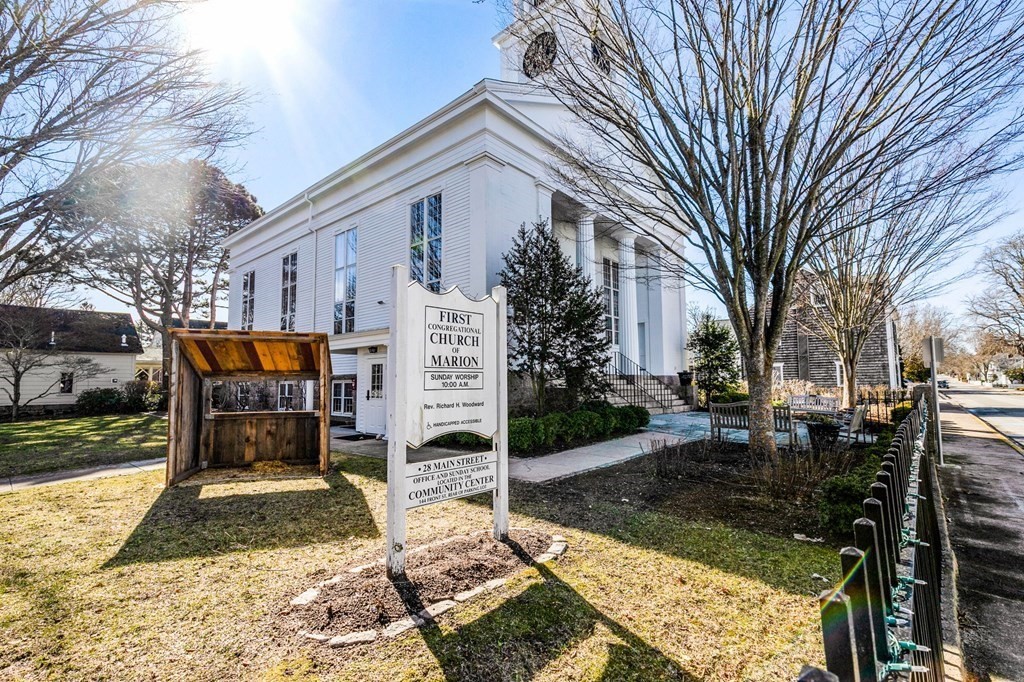 7 Zora Road Marion, MA 02738 - Photo 21 of 38 a wooden bench sitting in front of house