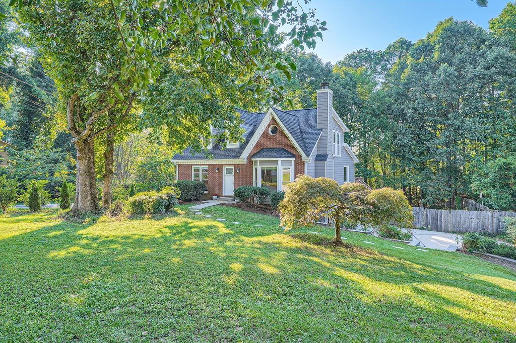 1620 Plunketts Road Buford, GA 30519 - Photo 1 of 1 a view of a house with a yard and sitting area