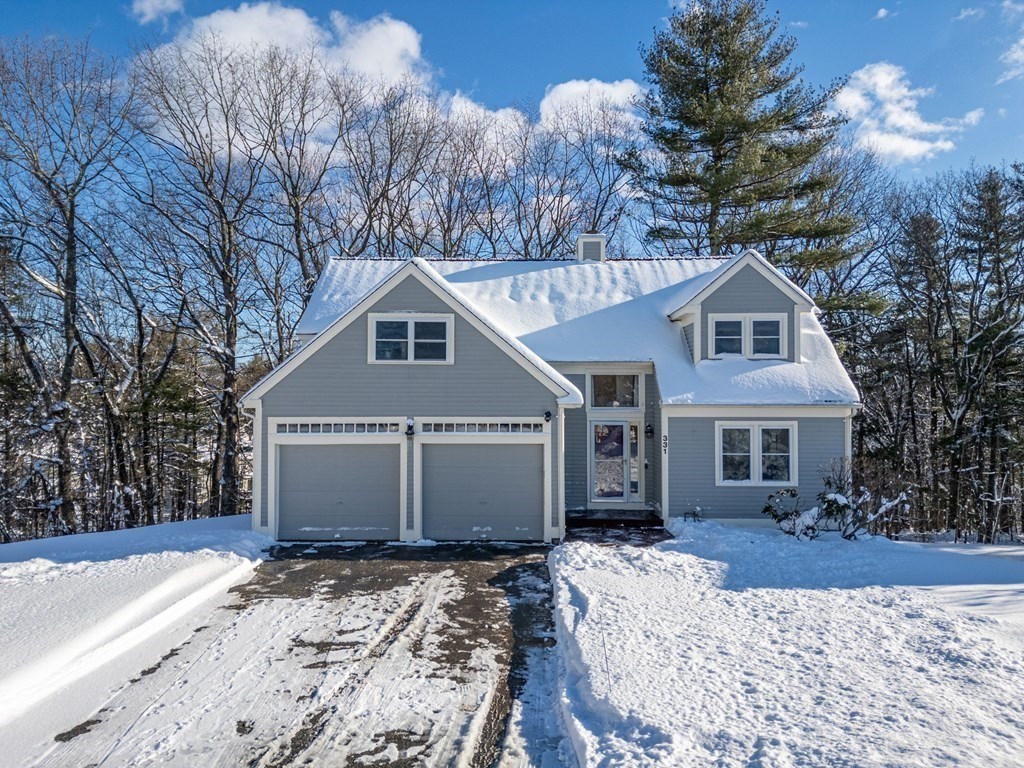 331 Fox Run Road, Unit 331 Hudson, NH 03051 - Photo 3 of 37 a front view of a house with a yard covered with snow