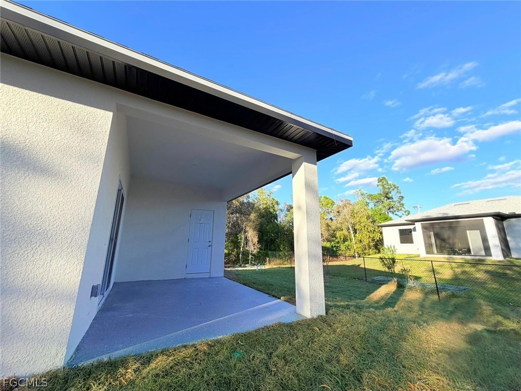 767 Crystal Avenue Lehigh Acres, FL 33974 - Photo 13 of 17 a view of house with backyard