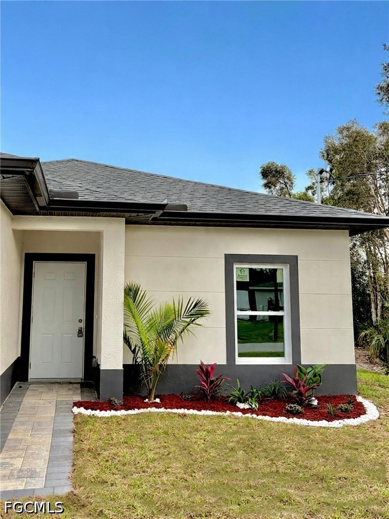 767 Crystal Avenue Lehigh Acres, FL 33974 - Photo 16 of 17 a front view of a house