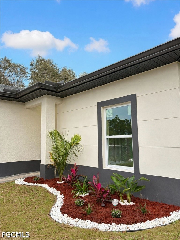 767 Crystal Avenue Lehigh Acres, FL 33974 - Photo 17 of 17 a view of a backyard of the house