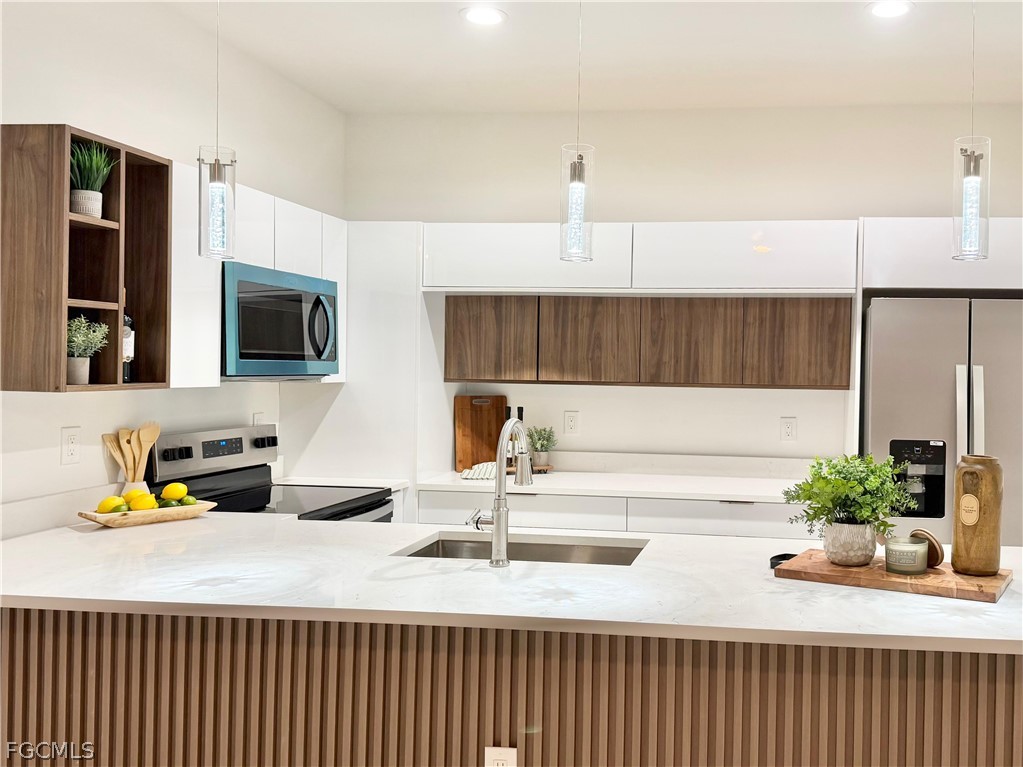 767 Crystal Avenue Lehigh Acres, FL 33974 - Photo 2 of 17 a bathroom with a sink a faucet and a mirror