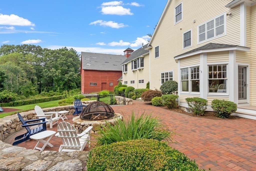 95 Westford Road Concord, MA 01742 - Photo 14 of 42 a view of a patio with table and chairs and potted plants