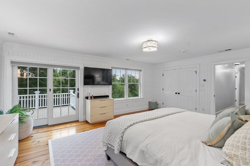 95 Westford Road Concord, MA 01742 - Photo 22 of 42 a bedroom with a bed and glass door