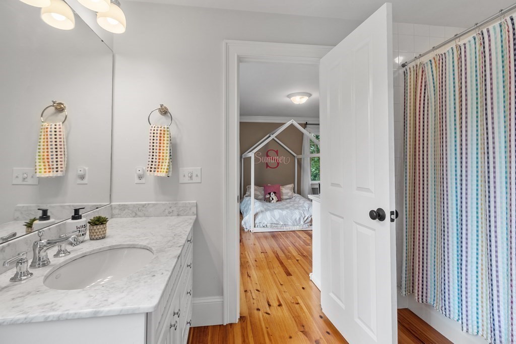 95 Westford Road Concord, MA 01742 - Photo 28 of 42 a en suite bathroom with a granite countertop sink and a mirror