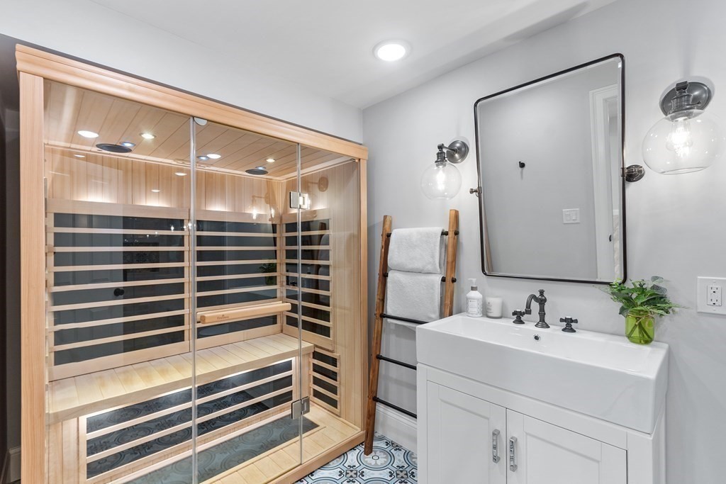 95 Westford Road Concord, MA 01742 - Photo 38 of 42 a bathroom with a sink shower and a mirror