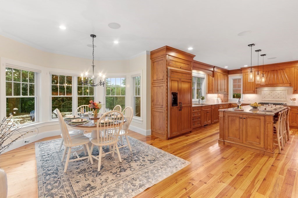 95 Westford Road Concord, MA 01742 - Photo 9 of 42 a dining room with granite countertop a coffee maker a table and chairs