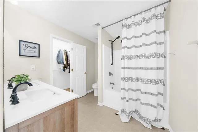 a bathroom with a shower curtain