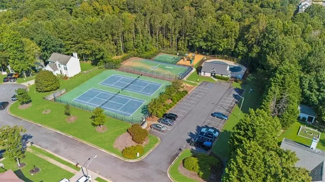 an aerial view of a house with a yard