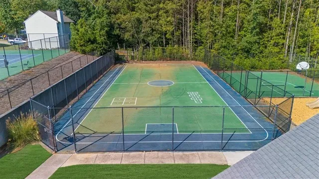 an outdoor space with furniture and umbrella