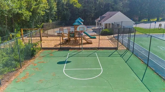 a view of a brick house with a small yard