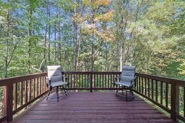 a view of balcony with wooden floor and outdoor seating