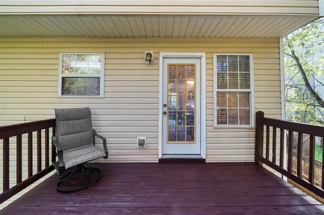 a view of front door and deck of the house