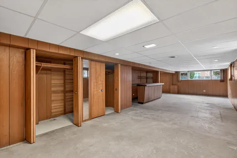 a view of an empty room with closet area
