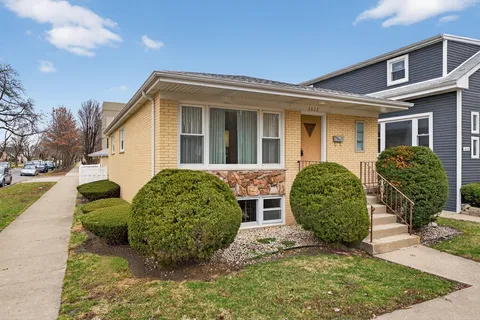 front view of a house with a garden