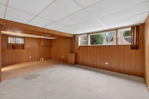 a view of an empty room with windows