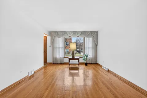 a view of a livingroom with furniture and wooden floor