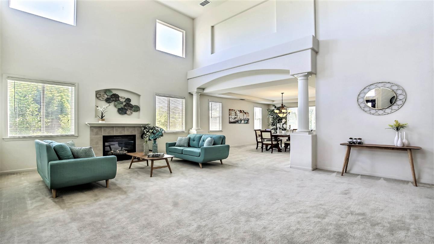 1447 Atlantic Avenue Ripon, CA 95366 - Photo 4 of 25 a living room with furniture and a fireplace