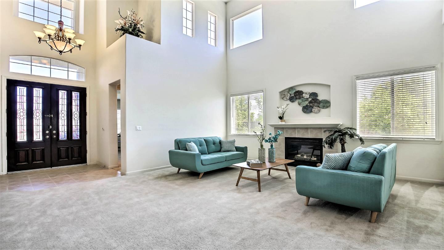 1447 Atlantic Avenue Ripon, CA 95366 - Photo 5 of 25 a living room with furniture and a fireplace