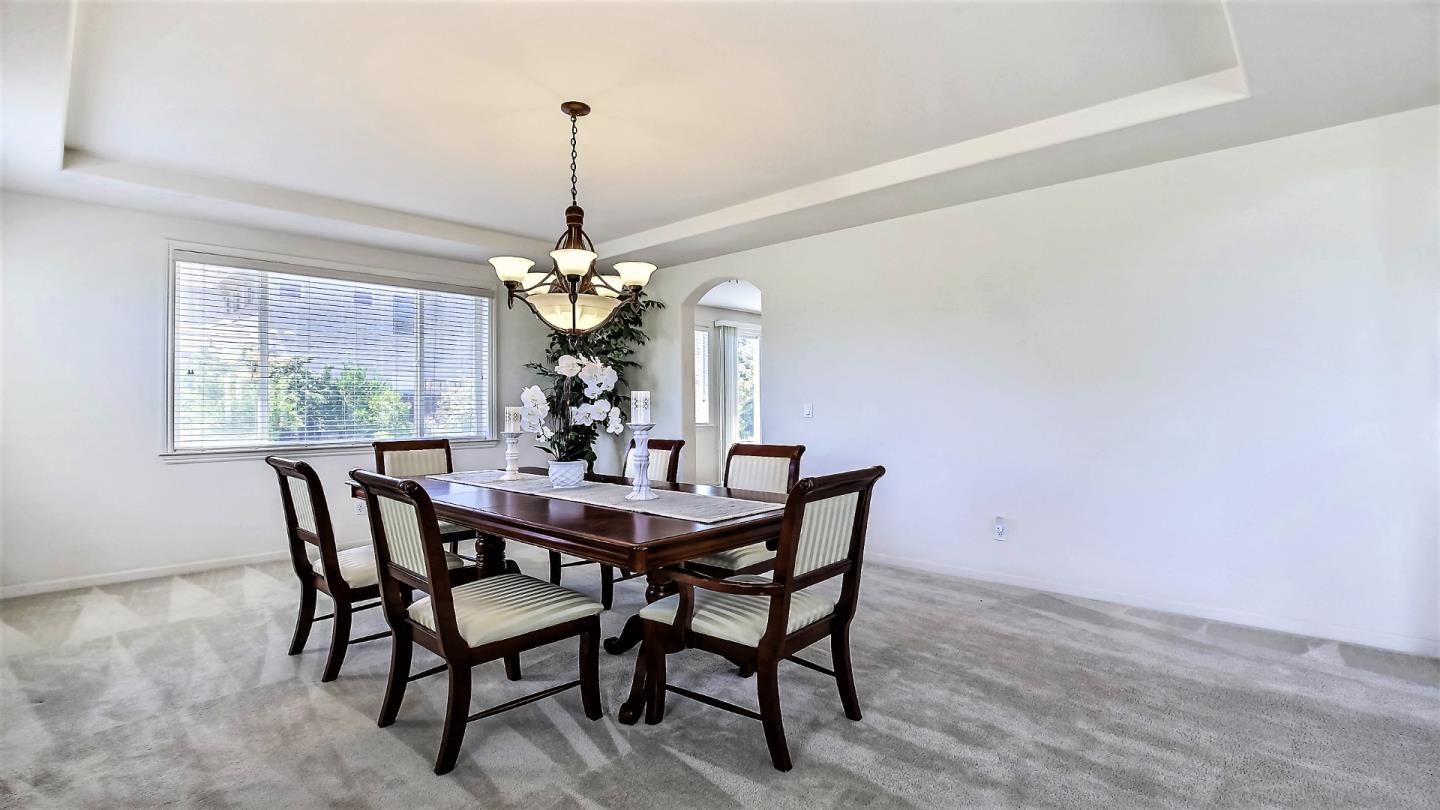 1447 Atlantic Avenue Ripon, CA 95366 - Photo 6 of 25 a dining room with furniture a chandelier and window