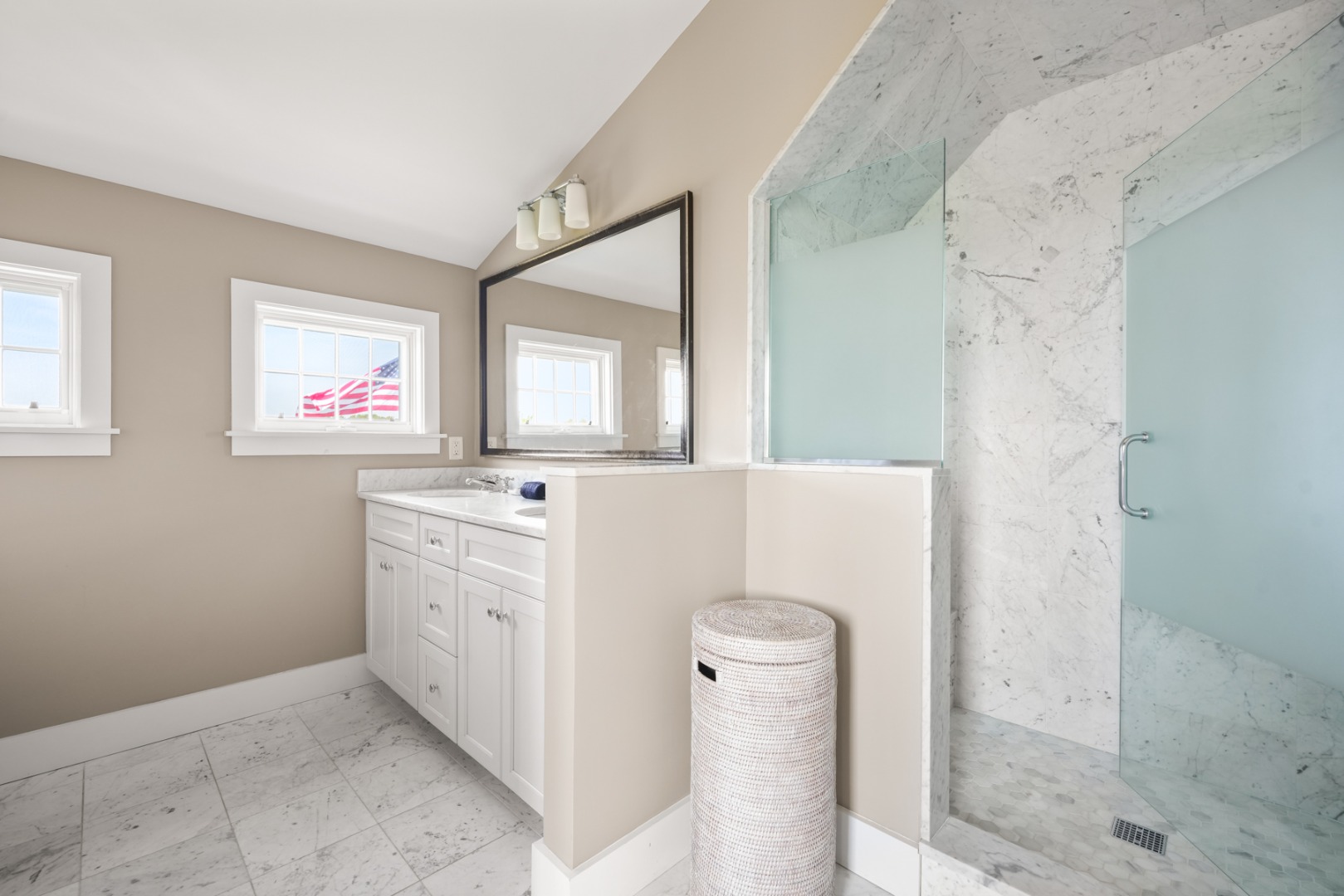 21 Quidnet Road Nantucket, MA 02554 - Photo 32 of 62 a bathroom with a sink a mirror and a shower