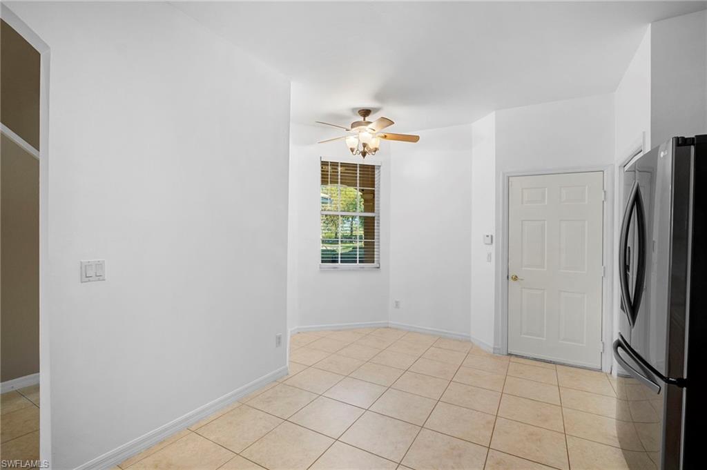 20000 Heatherstone Way, Unit 2 Estero, FL 33928 - Photo 13 of 20 a view of an empty room with window and refrigerator