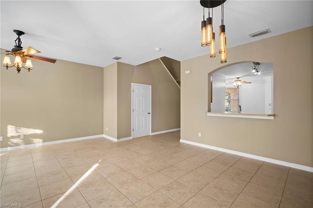 20000 Heatherstone Way, Unit 2 Estero, FL 33928 - Photo 14 of 20 a view of a livingroom with furniture and chandelier