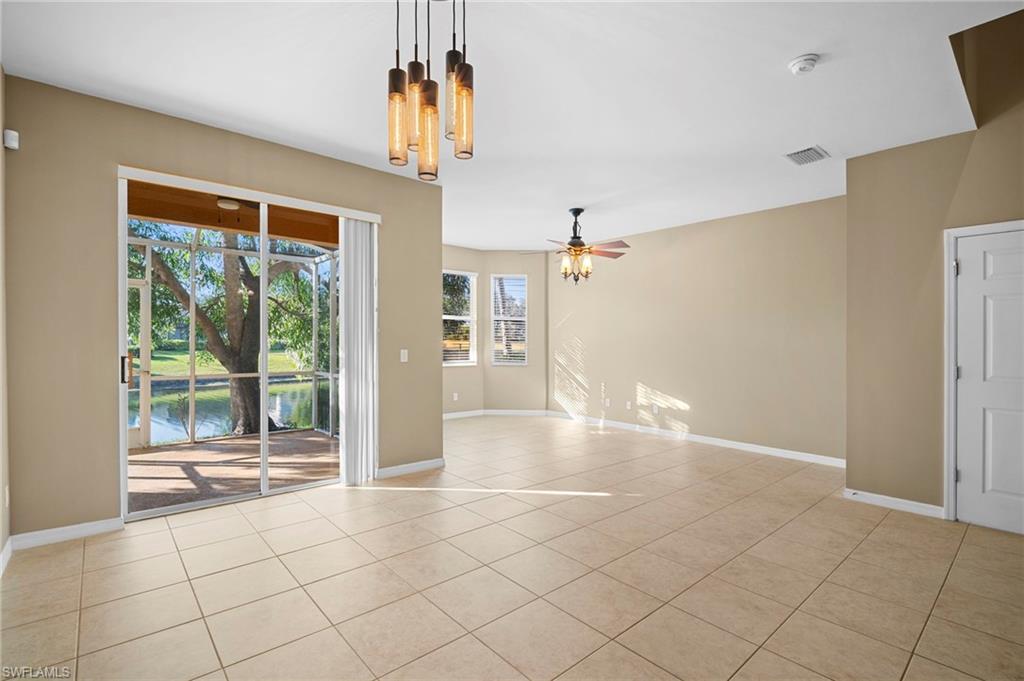 20000 Heatherstone Way, Unit 2 Estero, FL 33928 - Photo 15 of 20 a view of empty room with wooden floor and fan