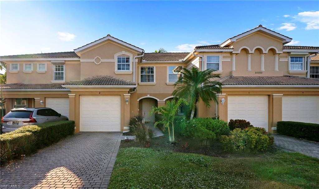 20000 Heatherstone Way, Unit 2 Estero, FL 33928 - Photo 2 of 20 a front view of a house with a garden