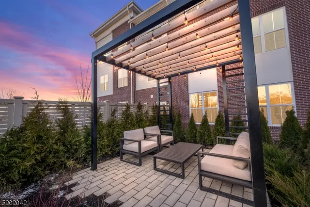 a patio with patio lots of furniture and garden