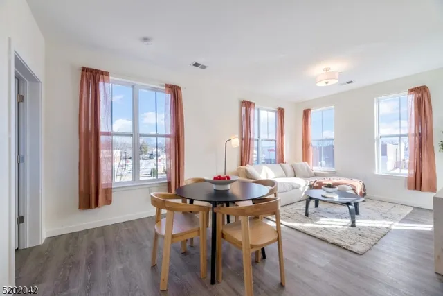 a dining room with furniture and windows