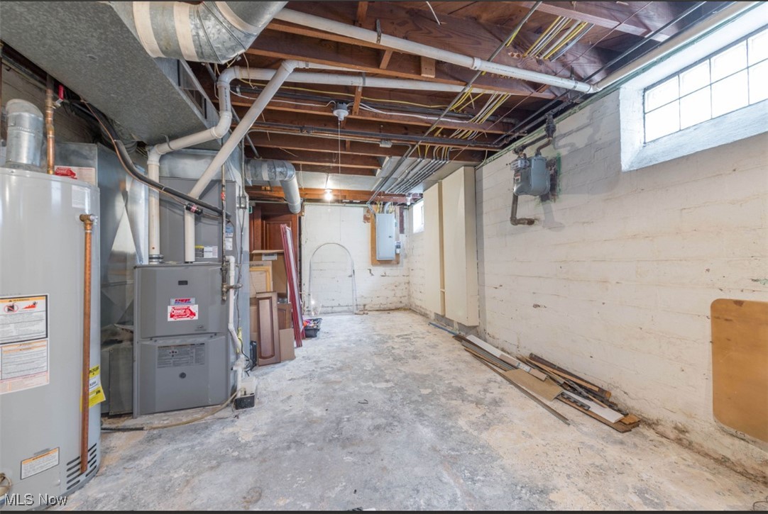 15500 Greenway Road Cleveland, OH 44111 - Photo 36 of 36 Basement with gas water heater, heating unit, and electric panel