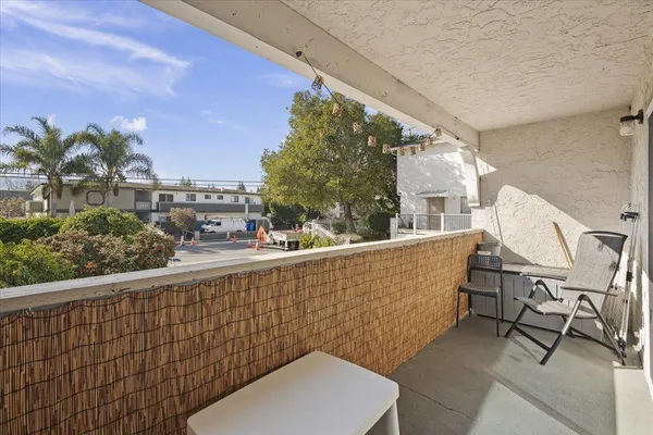 a view of balcony with furniture