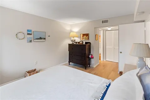 a bed room with a bed and dresser