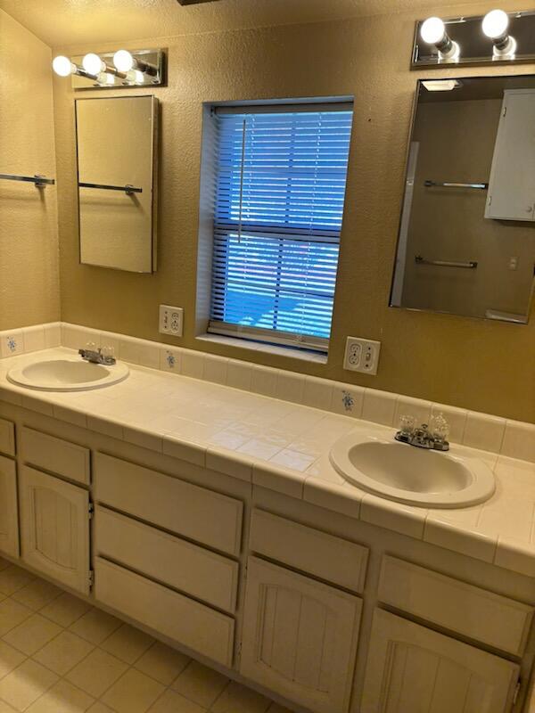 1862 Whaley Road Redding, CA 96003 - Photo 11 of 12 a bathroom with a sink and a mirror