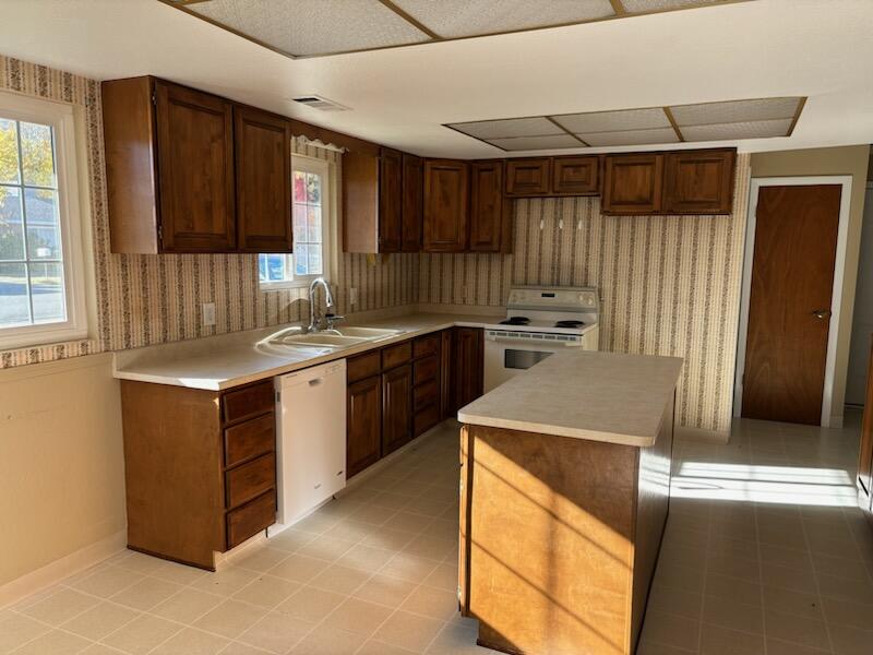 1862 Whaley Road Redding, CA 96003 - Photo 7 of 12 a kitchen with a stove sink and cabinets