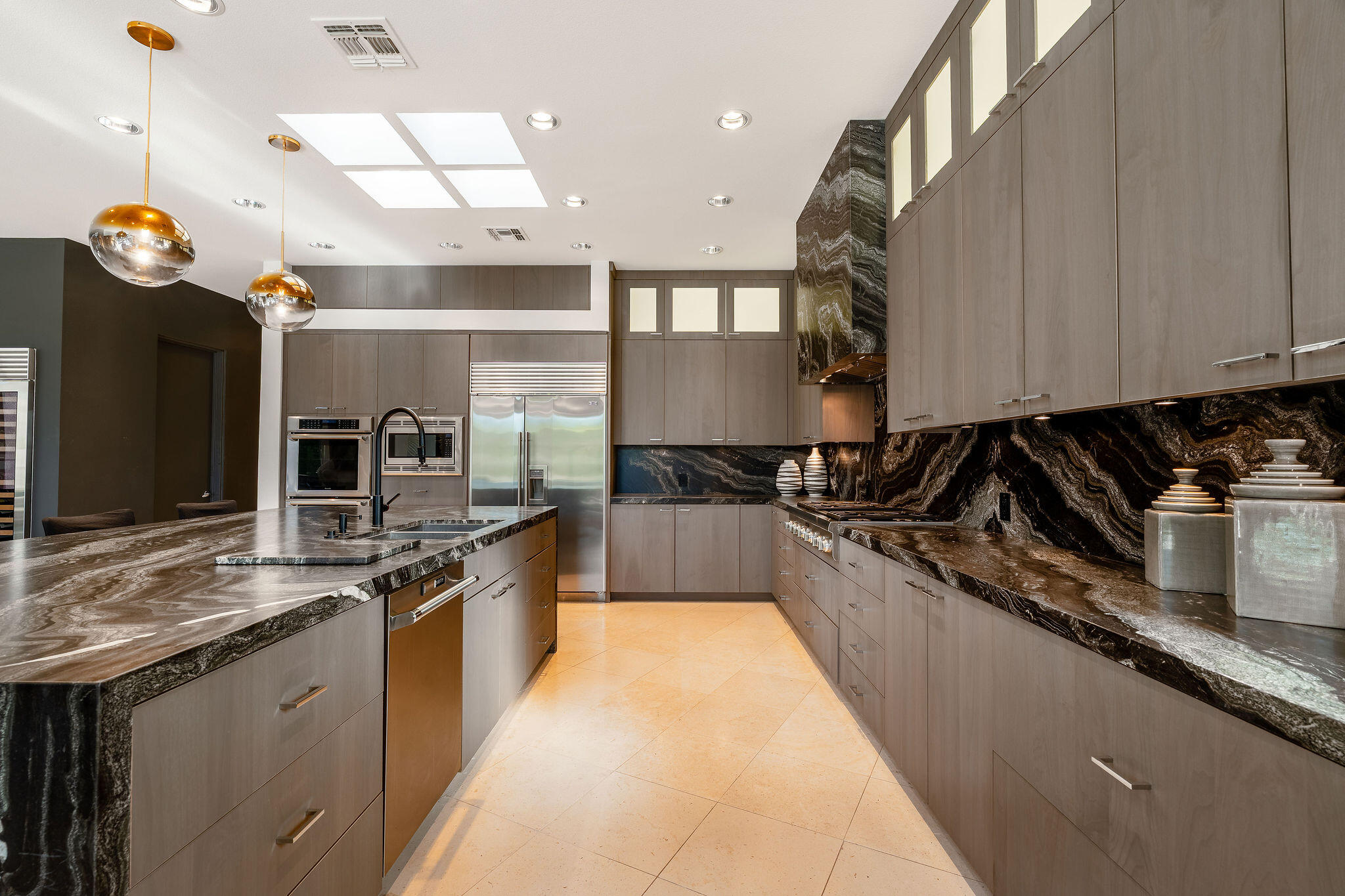 108 Waterford Circle Rancho Mirage, CA 92270 - Photo 13 of 41 a large kitchen with stainless steel appliances granite countertop a stove a sink and a refrigerator