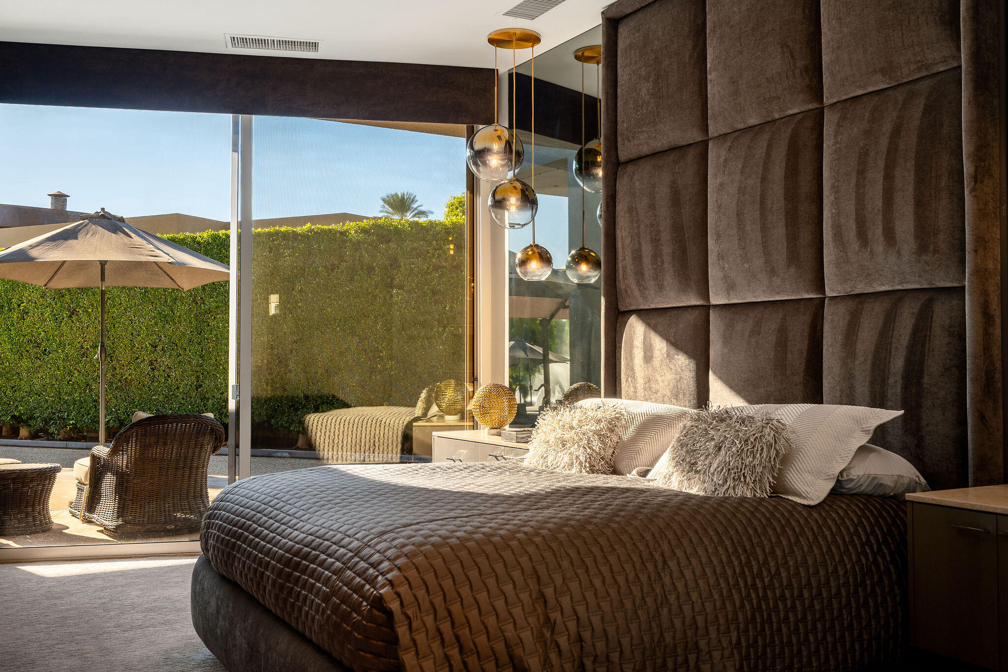 108 Waterford Circle Rancho Mirage, CA 92270 - Photo 20 of 41 a bedroom with a bed a table and chair