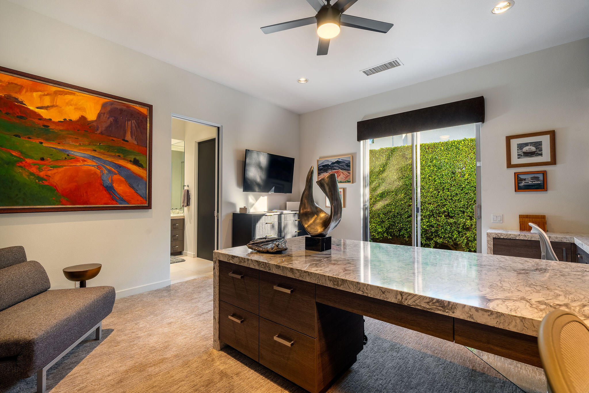 108 Waterford Circle Rancho Mirage, CA 92270 - Photo 27 of 41 a living room with furniture flat screen tv and a large window