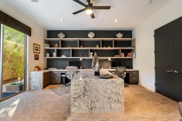 a bed room with a bed and a book shelf