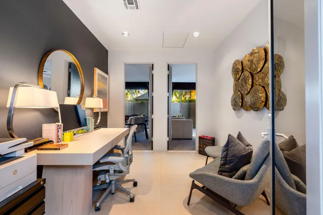 a workspace with furniture and a wooden floor