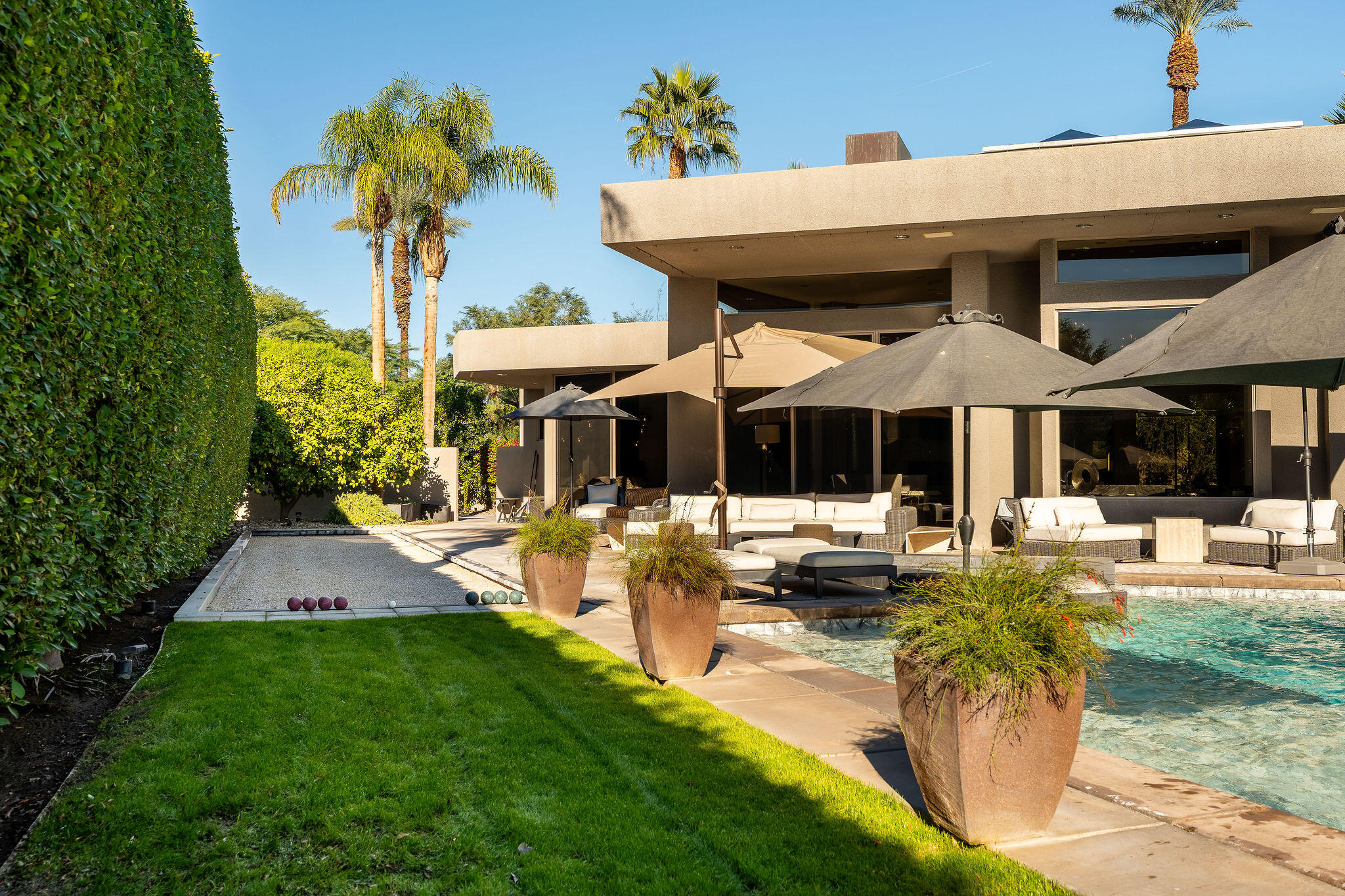 108 Waterford Circle Rancho Mirage, CA 92270 - Photo 37 of 41 a view of a house with swimming pool and chairs