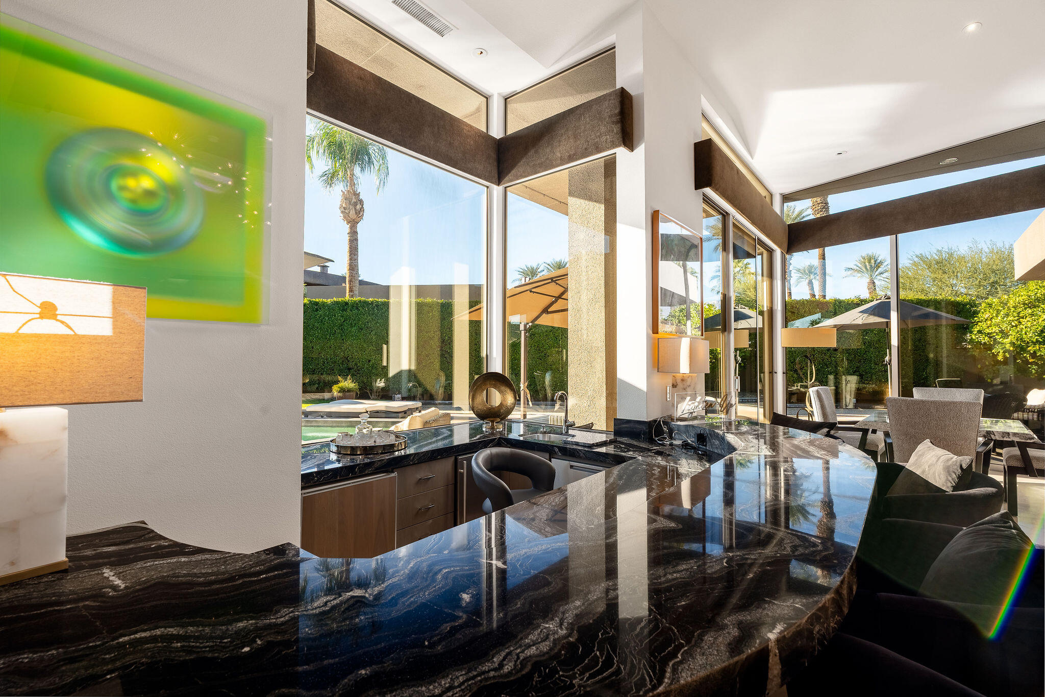 108 Waterford Circle Rancho Mirage, CA 92270 - Photo 8 of 41 a kitchen with a large window and living room