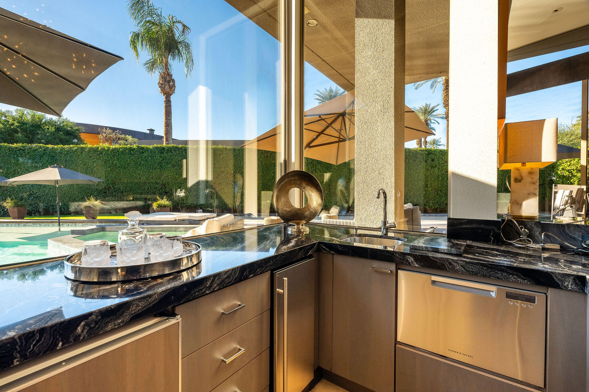 108 Waterford Circle Rancho Mirage, CA 92270 - Photo 9 of 41 a kitchen with a sink and a stove