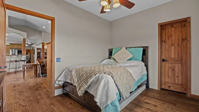 a living room filled with furniture and a wooden floor