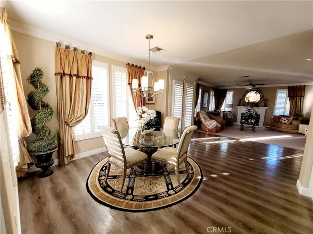 a living room with furniture gym equipment and a large window