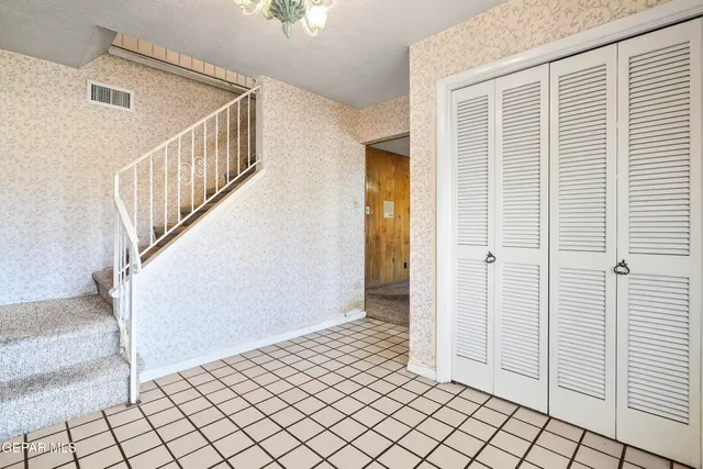 a big room with a bed and a window